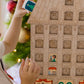 children putting the printed tiles into the festive adent calendar