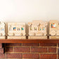 Wooden train advent calendar on a mantle