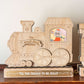 Wooden train decoration with 'Holly Jolly Express' on a shelf.
