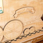 Wooden toy train model with 'The Holly Jolly Express' and 'The Locke Family' branding on a wooden surface.
